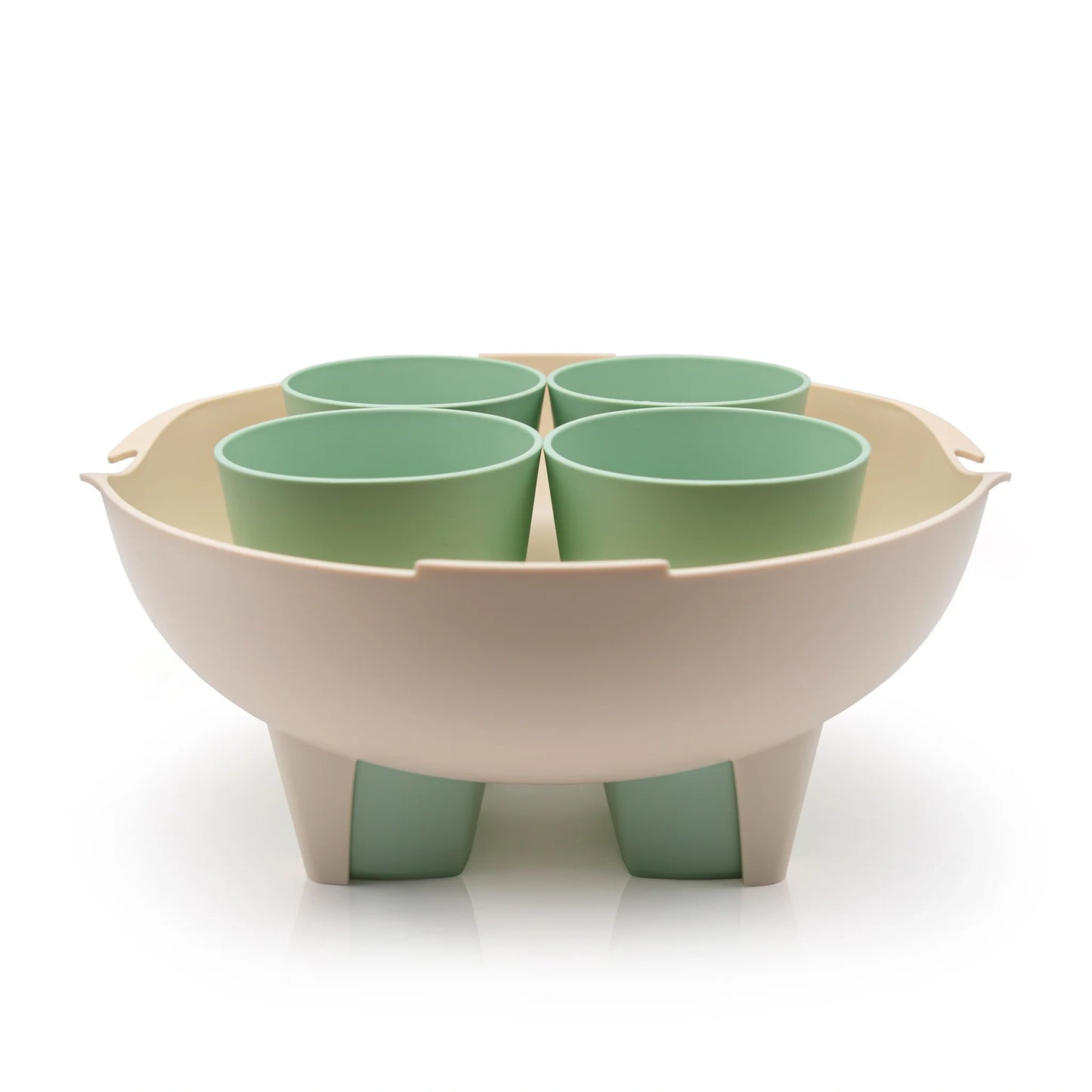 A set of four cups with a cup holder made from waste sugarcane