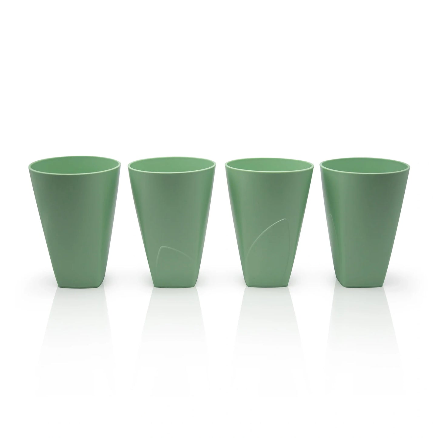 A set of four cups with a cup holder made from waste sugarcane